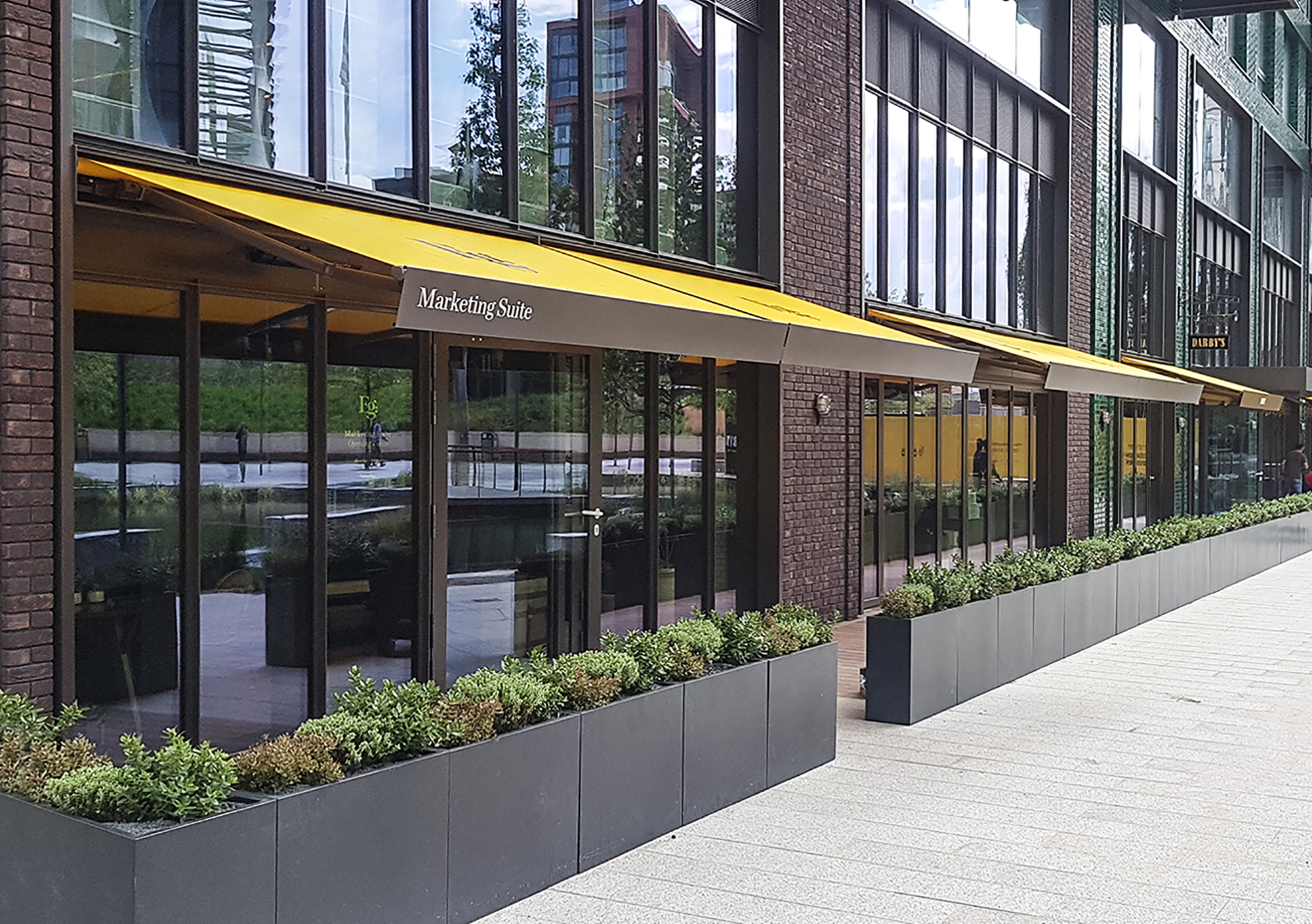 SQ2 awnings with bespoke encasement for Darby’s at Embassy Gardens, London.