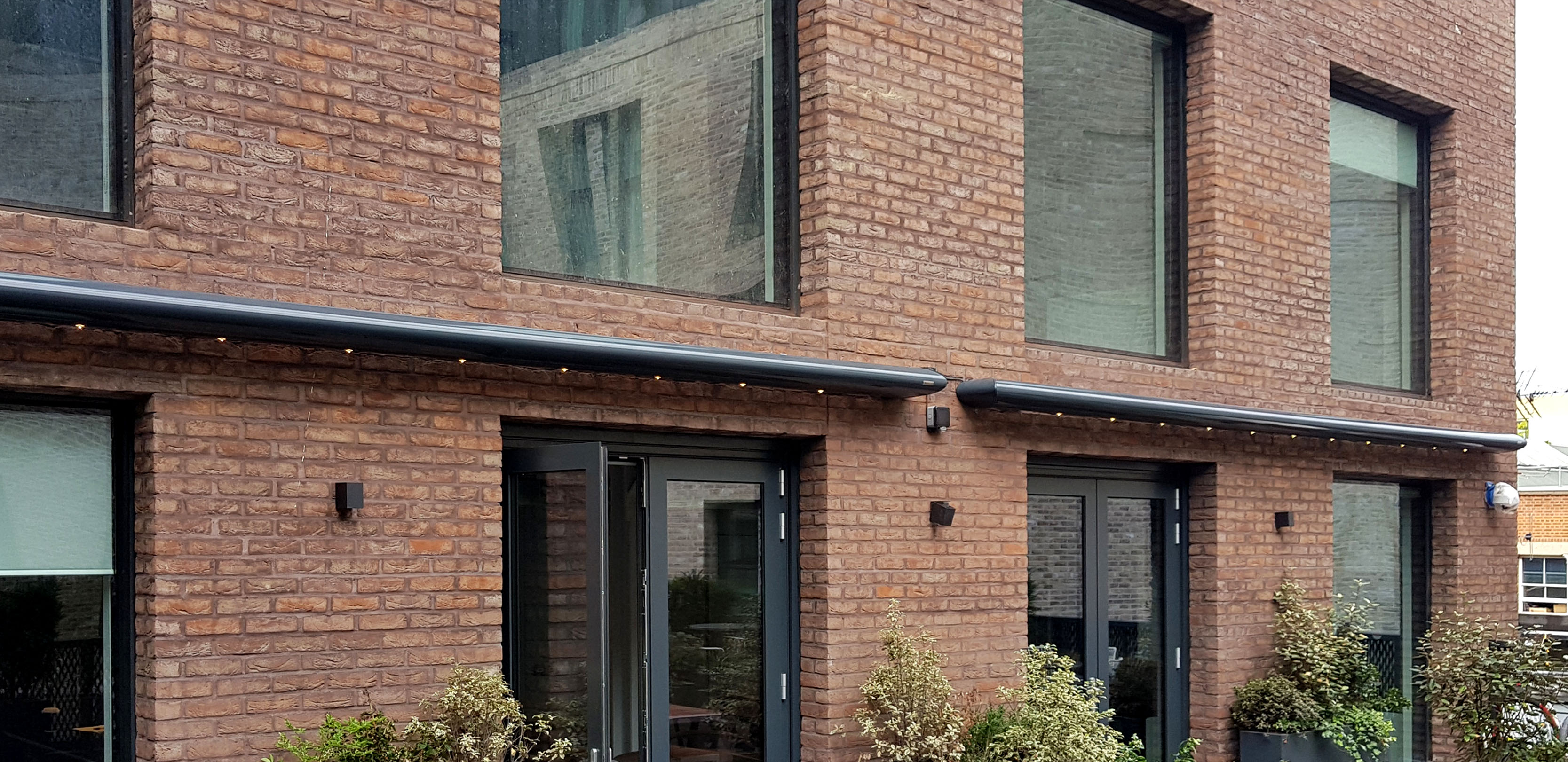 Zenara awnings at Spring Mews with LED Lights